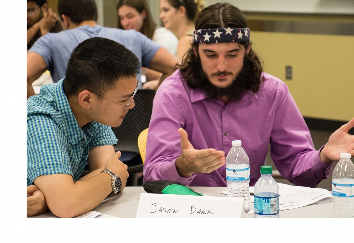 Teacher Demonstrating to student at table